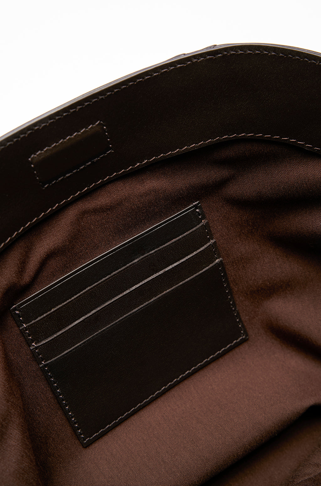 Leather Slouchy Clutch With Metallic Monogram