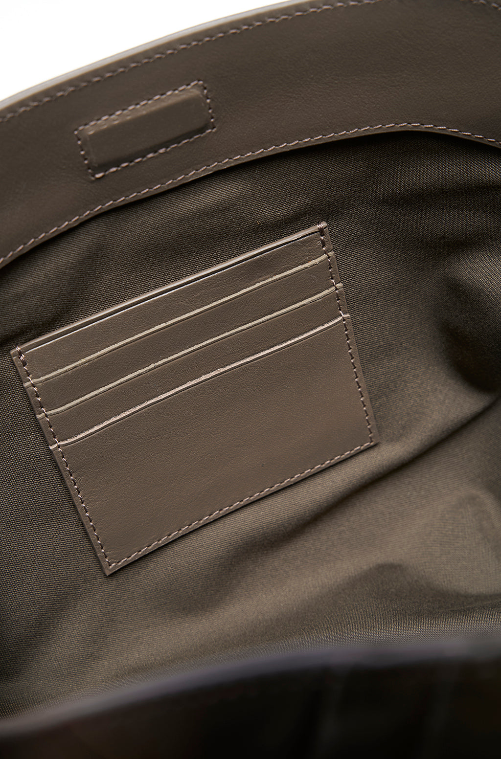 Leather Slouchy Clutch With Metallic Monogram