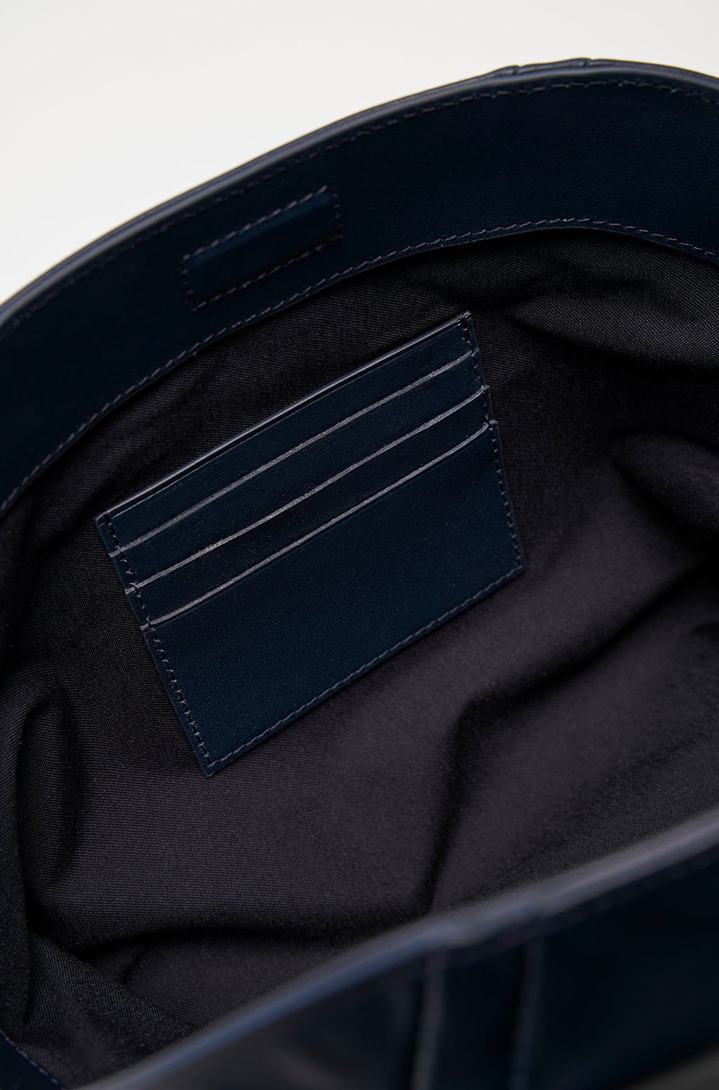 Leather Slouchy Clutch With Metallic Monogram